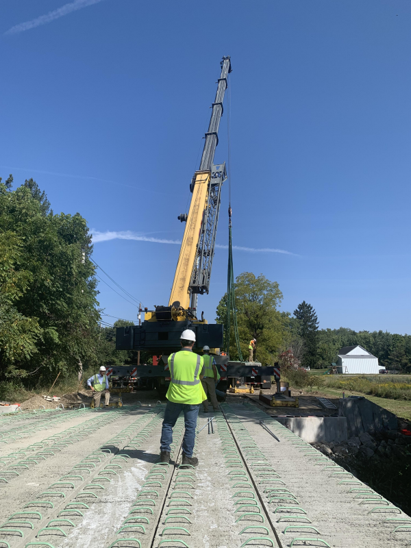 Image of South Main St Bridge beam laying 2 title=